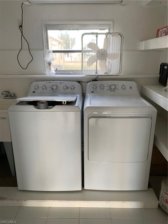 9322 Pitt Road Bonita Springs, FL 34135 - Photo 24 of 24 a utility room with washer and dryer
