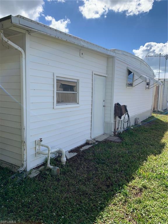 9322 Pitt Road Bonita Springs, FL 34135 - Photo 3 of 24 a backyard of a house with table and chairs