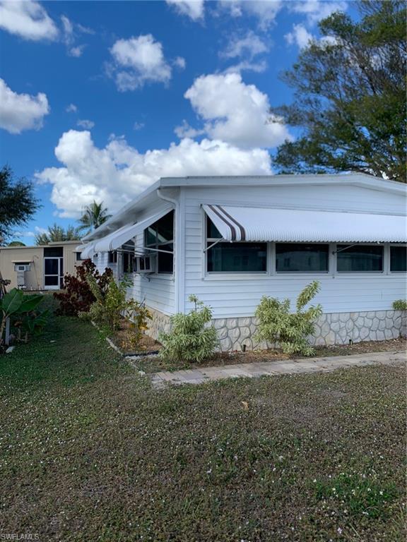 9322 Pitt Road Bonita Springs, FL 34135 - Photo 7 of 24 a front view of house with yard