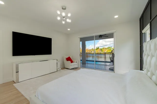 a view of a livingroom with furniture and a flat screen tv