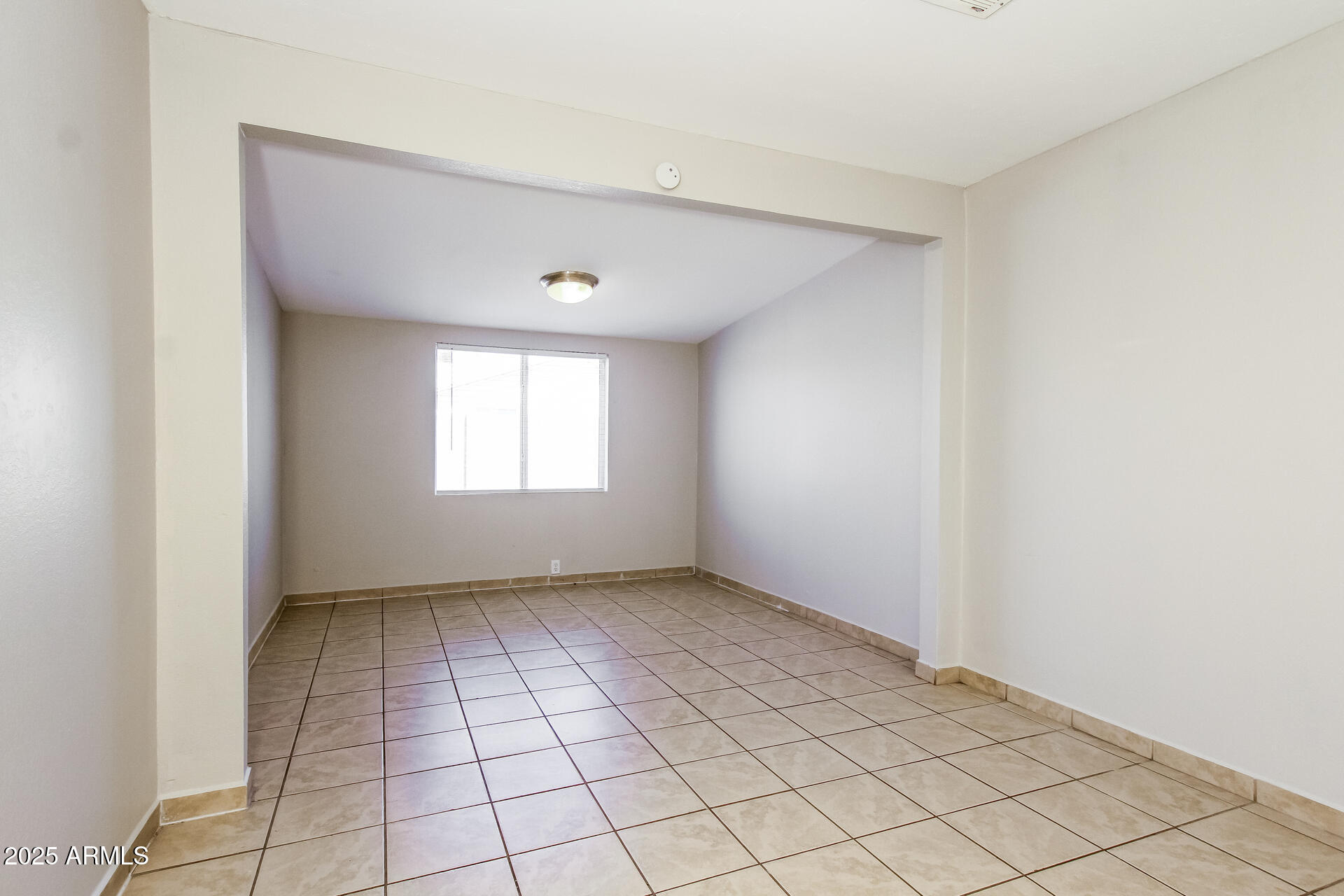 7130 West Merrell Street Phoenix, AZ 85033 - Photo 11 of 21 a view of an empty room and window