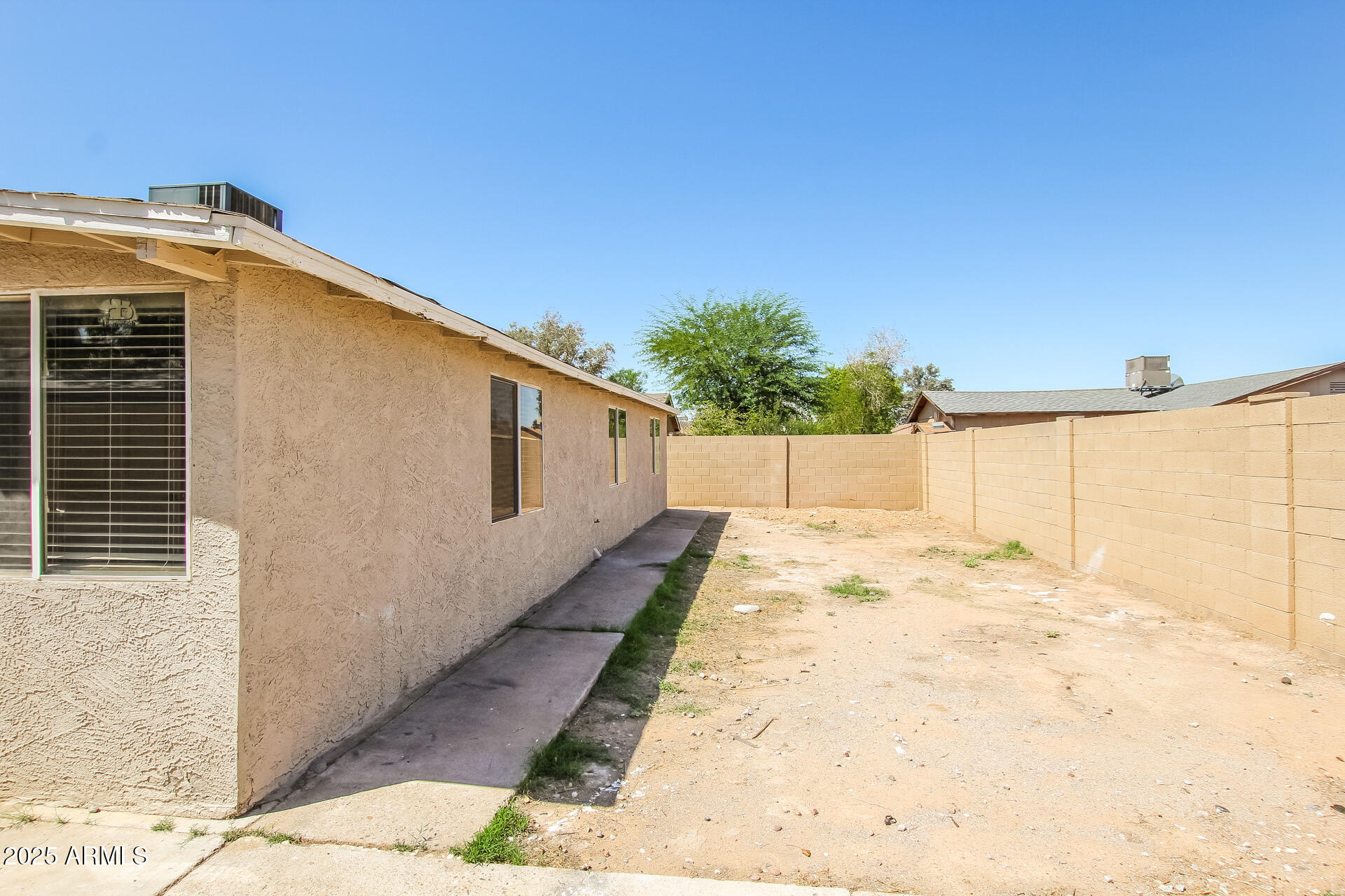 7130 West Merrell Street Phoenix, AZ 85033 - Photo 19 of 21 a backyard of a house with a yard