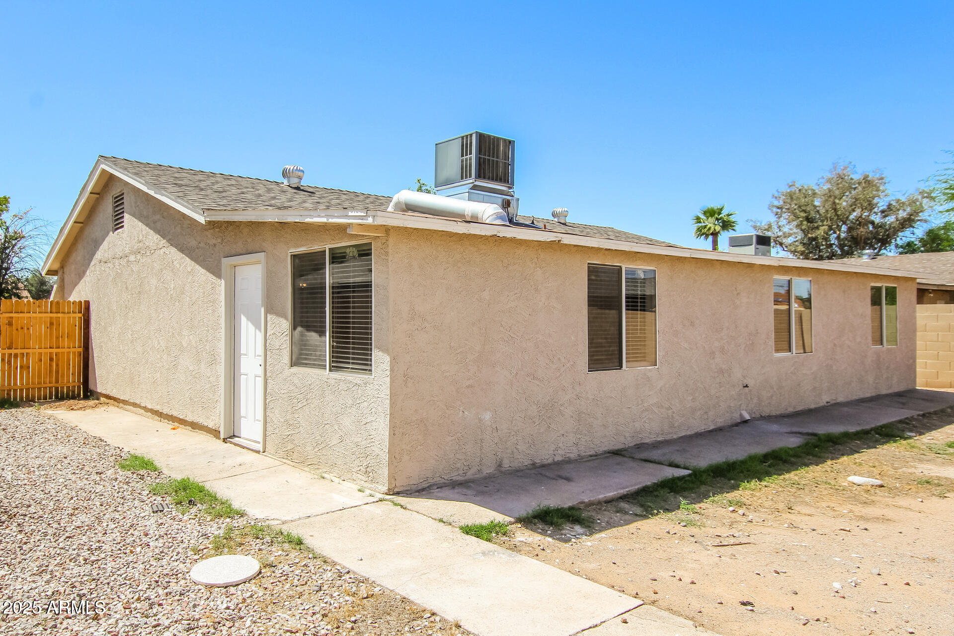 7130 West Merrell Street Phoenix, AZ 85033 - Photo 20 of 21 a house view with a backyard