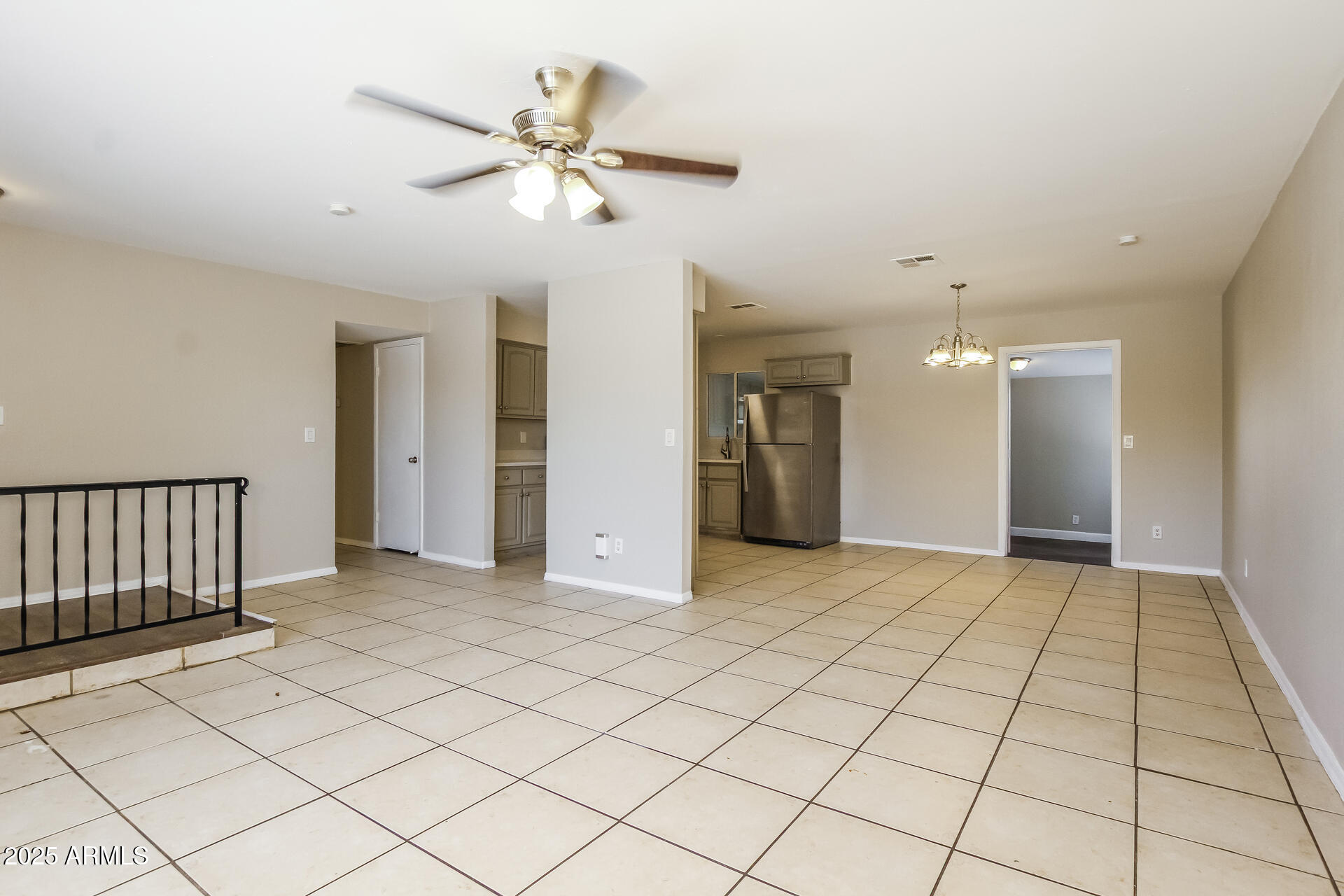 7130 West Merrell Street Phoenix, AZ 85033 - Photo 4 of 21 a view of an empty room and a ceiling fan