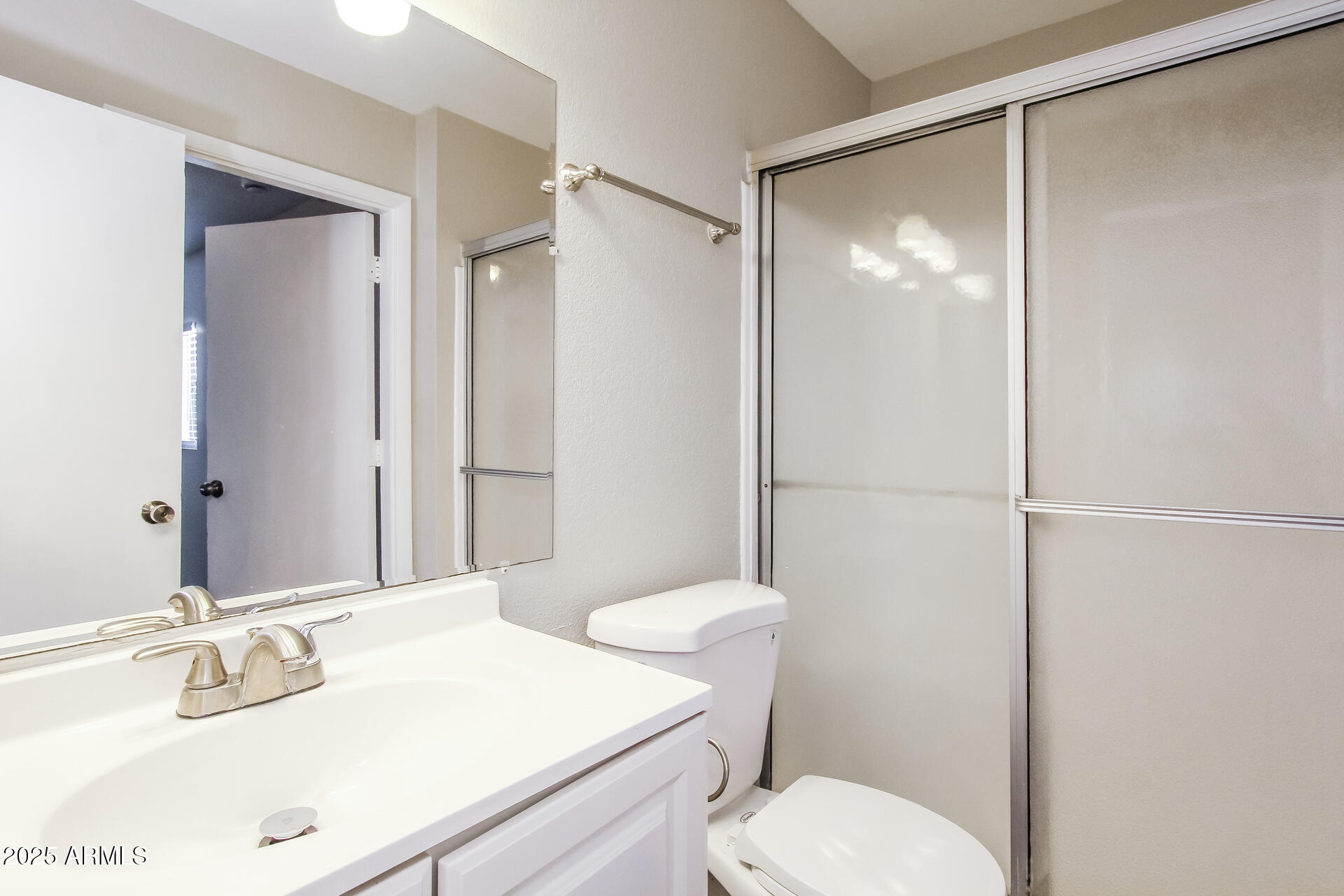 7130 West Merrell Street Phoenix, AZ 85033 - Photo 9 of 21 a bathroom with a sink toilet and shower