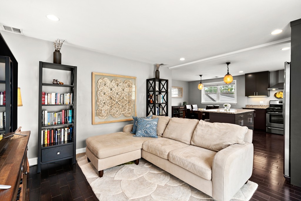 36 River Street, Unit 2 Arlington, MA 02474 - Photo 11 of 32 a living room with furniture and a book shelf