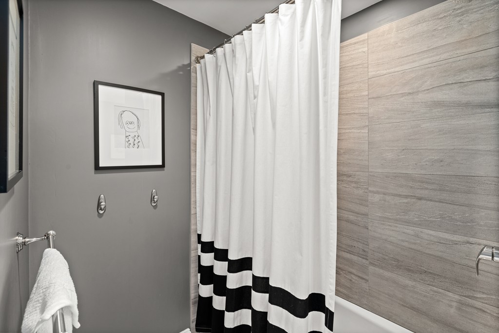 36 River Street, Unit 2 Arlington, MA 02474 - Photo 14 of 32 a bathroom with a sink and a mirror