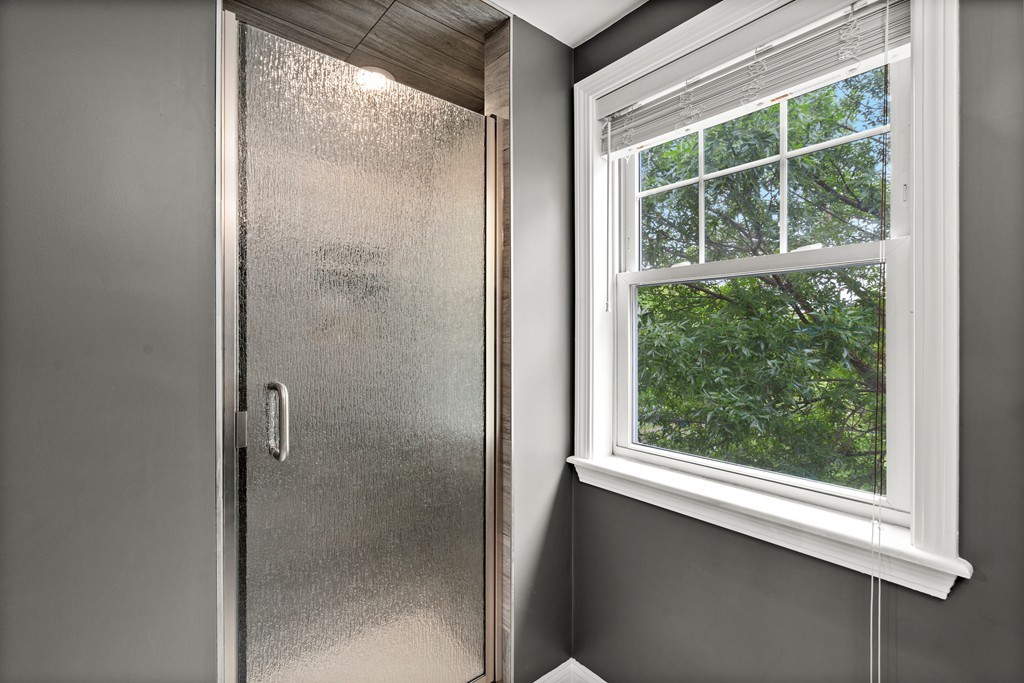 36 River Street, Unit 2 Arlington, MA 02474 - Photo 20 of 32 a bathroom with a glass shower door