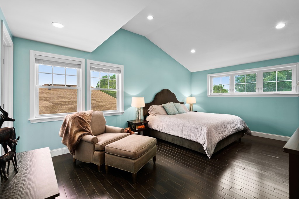 36 River Street, Unit 2 Arlington, MA 02474 - Photo 21 of 32 a bedroom with a bed and a couch