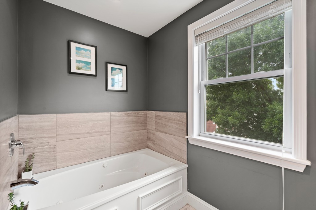 36 River Street, Unit 2 Arlington, MA 02474 - Photo 24 of 32 a bathroom with a bathtub and window