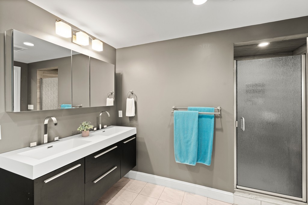 36 River Street, Unit 2 Arlington, MA 02474 - Photo 25 of 32 a bathroom with a sink and a mirror