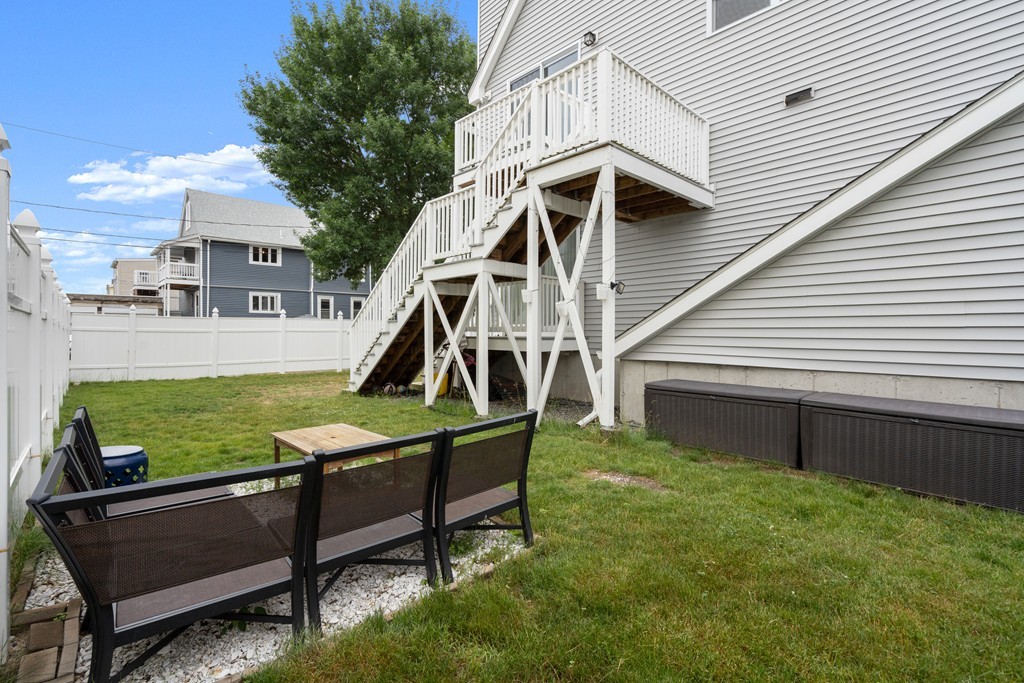 36 River Street, Unit 2 Arlington, MA 02474 - Photo 30 of 32 a view of a house with backyard and sitting area