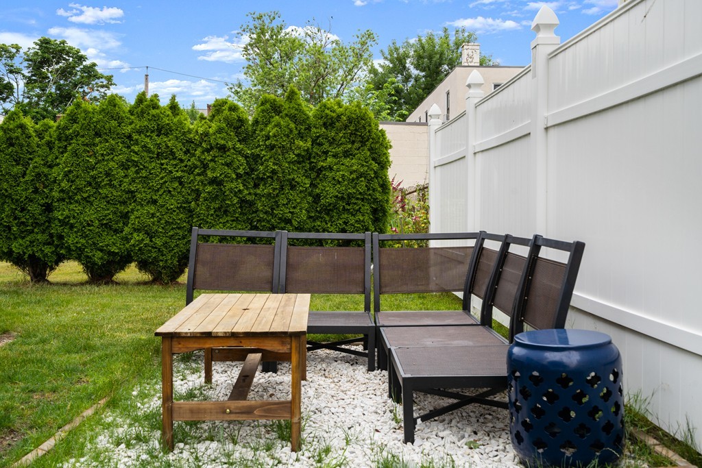 36 River Street, Unit 2 Arlington, MA 02474 - Photo 31 of 32 an outdoor sitting area with furniture and garden