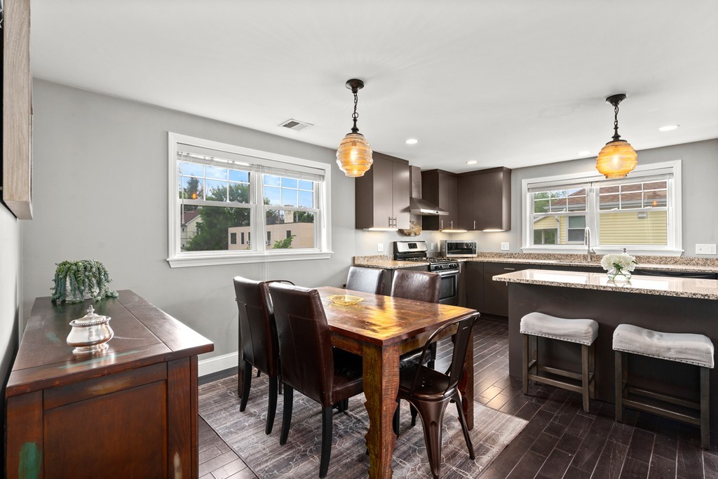 36 River Street, Unit 2 Arlington, MA 02474 - Photo 4 of 32 a dining room with furniture a chandelier and wooden floor