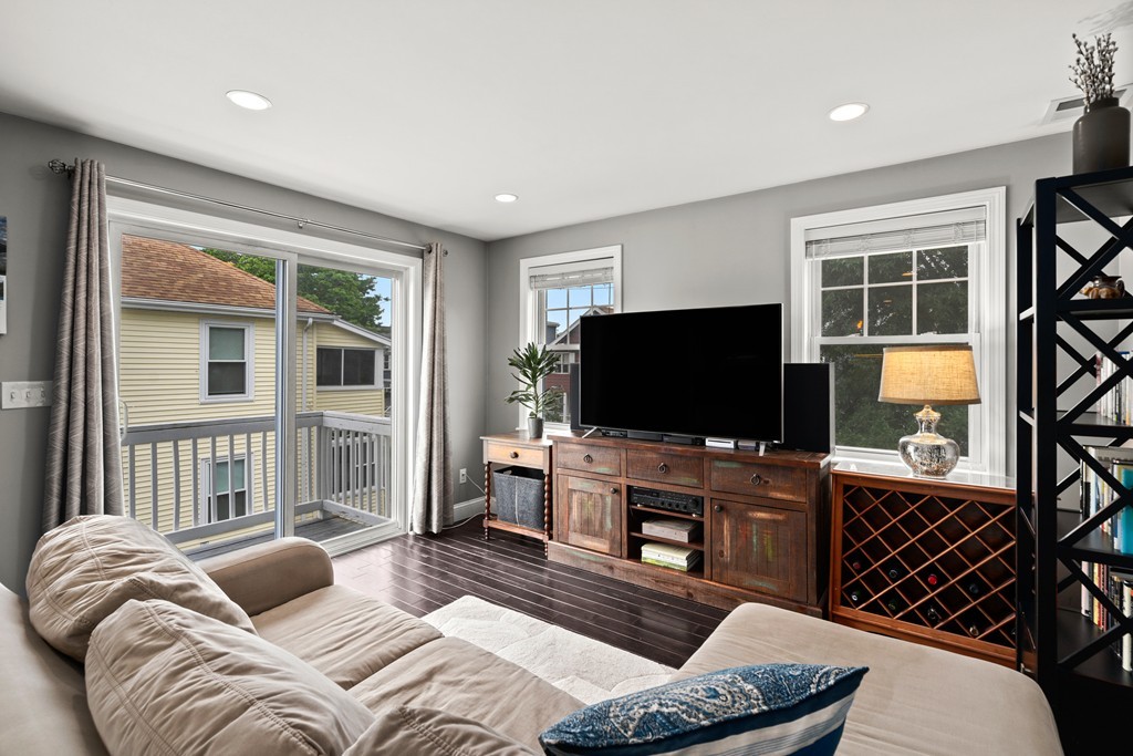 36 River Street, Unit 2 Arlington, MA 02474 - Photo 9 of 32 a living room with furniture and a flat screen tv