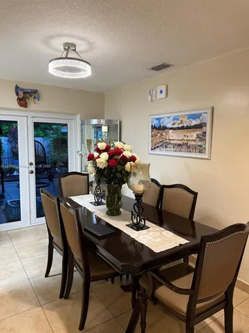 a bathroom with a shower and a glass door