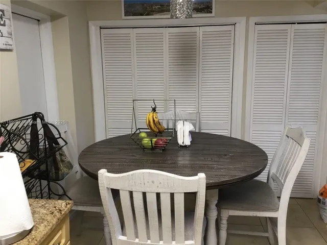 a bedroom with a sink and a mirror