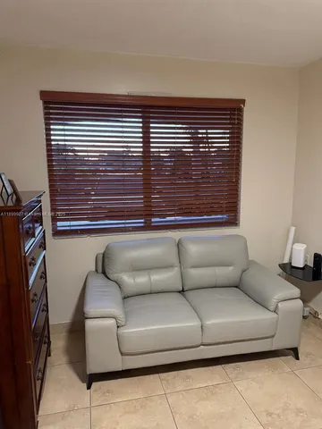a view of bathroom with a toilet and mirror