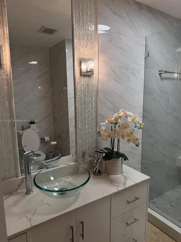 a view of a water fountain and a garage