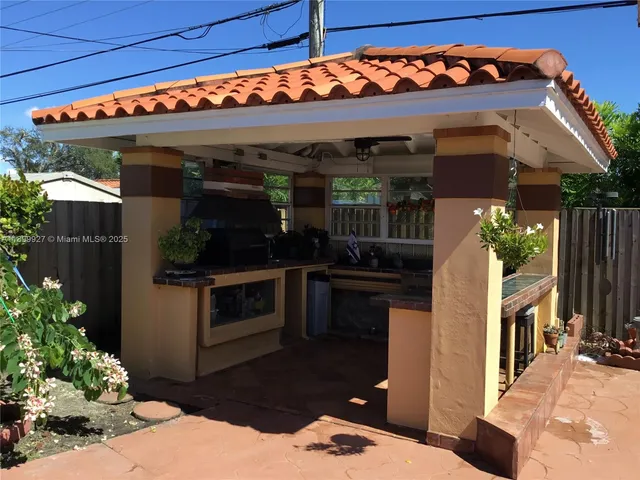 a view of path in between the bunch of flowers