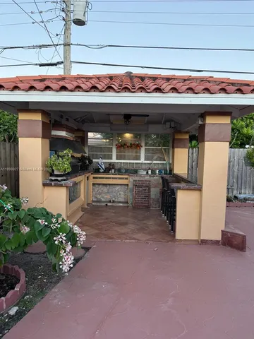 a view of a back yard of the house