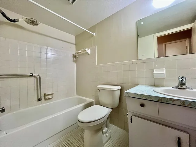 a bathroom with a sink a toilet and a bathtub