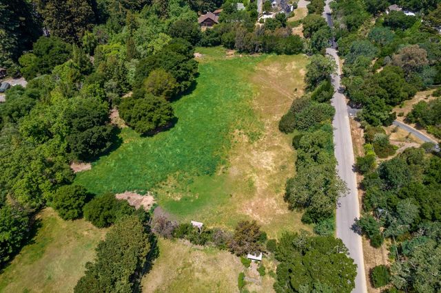 a view of a garden with a lake view