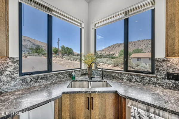 a kitchen with stainless steel appliances granite countertop lots of counter top space and wooden floor
