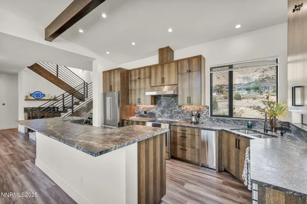 a bathroom with a granite countertop shower and a sink