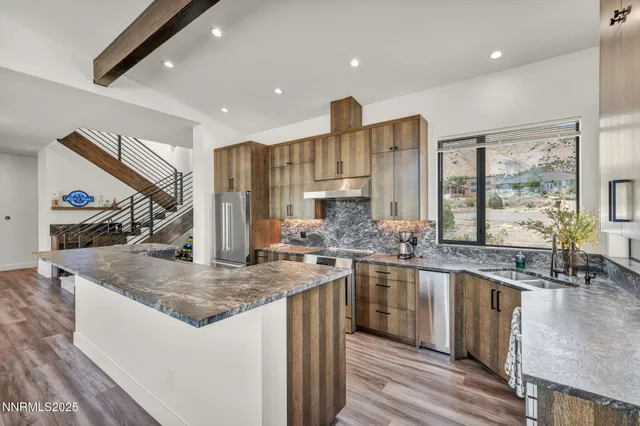 a bathroom with a granite countertop shower and a sink