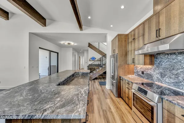 a kitchen with cabinets and appliances