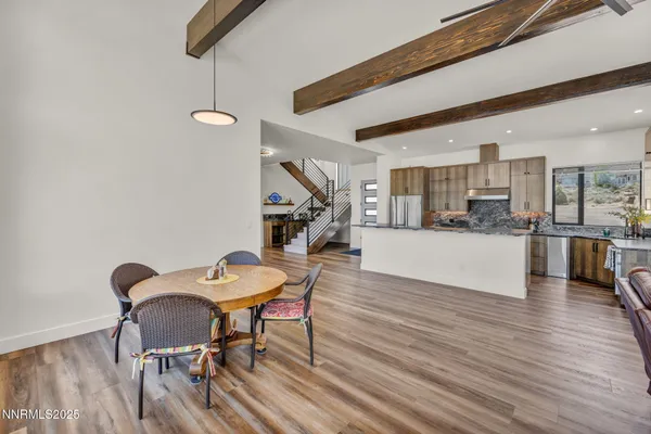 a kitchen with granite countertop a sink and a stove top oven