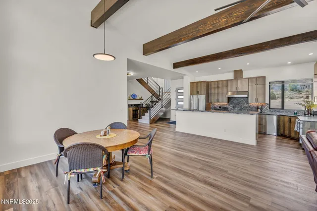 a kitchen with granite countertop a sink and a stove top oven