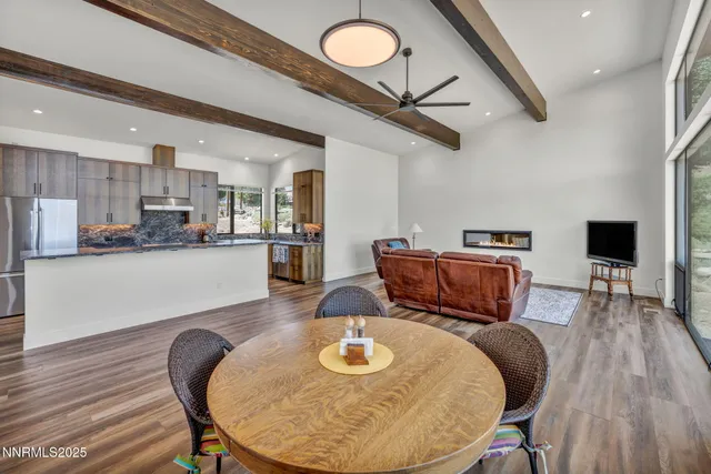 a view of a livingroom with wooden floor and a window