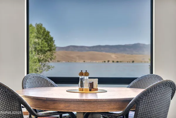 a bathroom with a granite countertop sink a mirror and a shower
