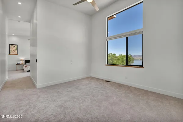 a utility room with dryer and cabinets