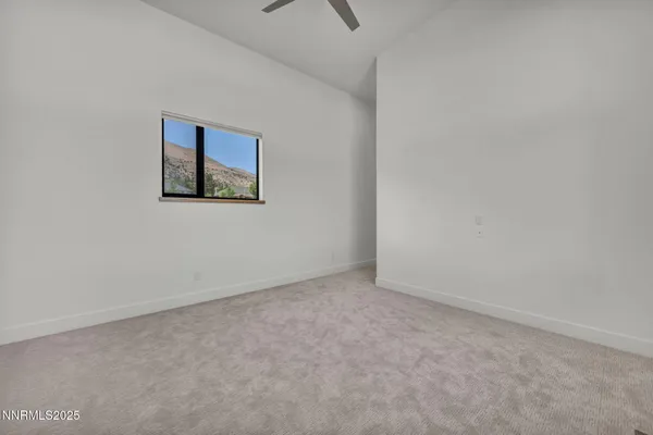 a view of a patio with a table and chairs