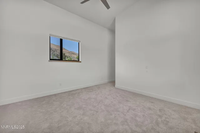 a view of a patio with a table and chairs