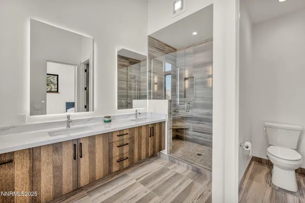 a view of a patio with table and chairs with wooden floor and fence