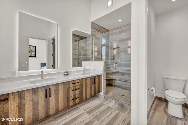 a view of a patio with table and chairs with wooden floor and fence