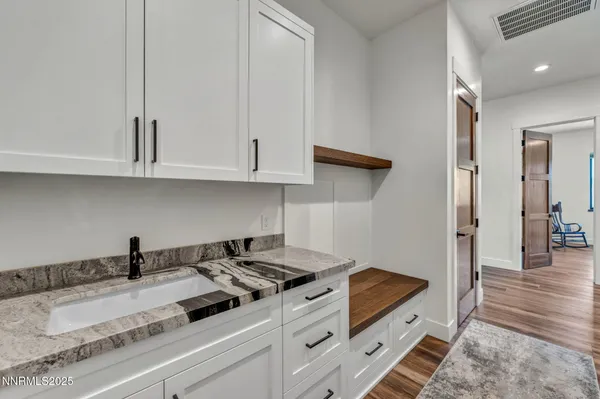 an aerial view of a house with a lake view