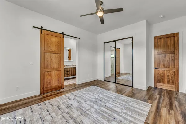 a view of a house with a yard and pathway