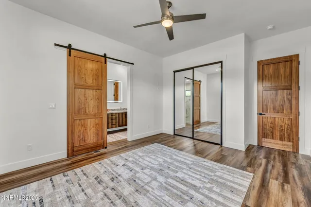 a view of a house with a yard and pathway