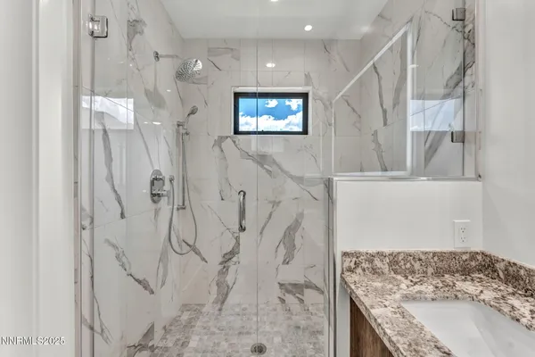 a view of a house with a yard and potted plants