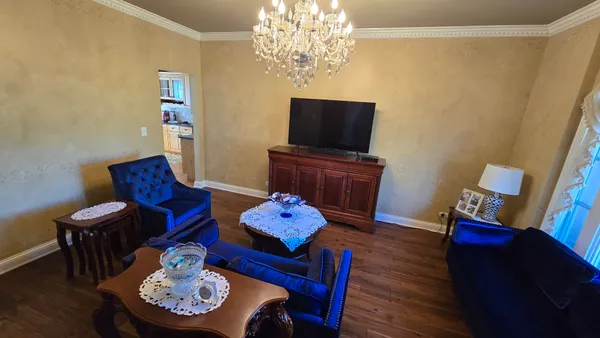 a living room with furniture and a flat screen tv