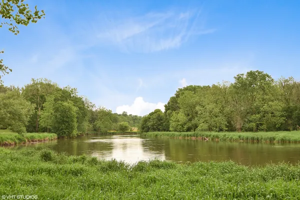 a view of lake with green space