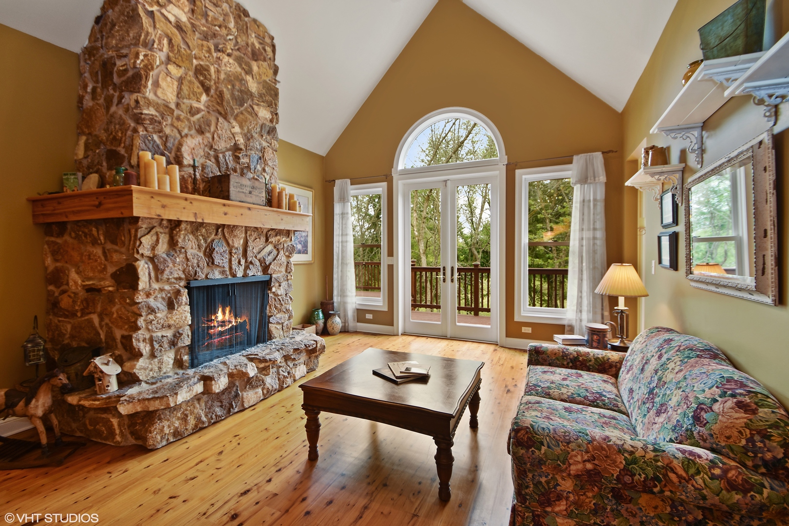 26010 West Airport Road Minooka, IL 60447 - Photo 7 of 28 a living room with furniture a fireplace and a floor to ceiling window