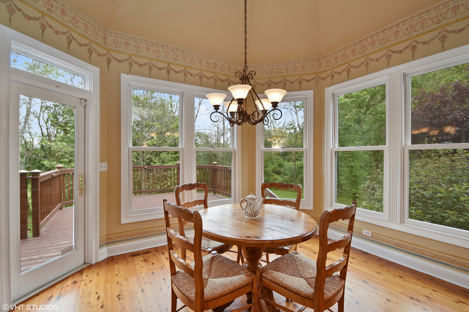 26010 West Airport Road Minooka, IL 60447 - Photo 10 of 28 a view of a dining room with furniture a chandelier and wooden floor