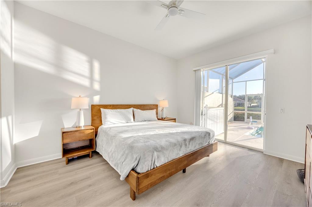 4708 Rio Poco Court Naples, FL 34109 - Photo 24 of 37 Bedroom with light wood-style flooring, access to outside, and a ceiling fan