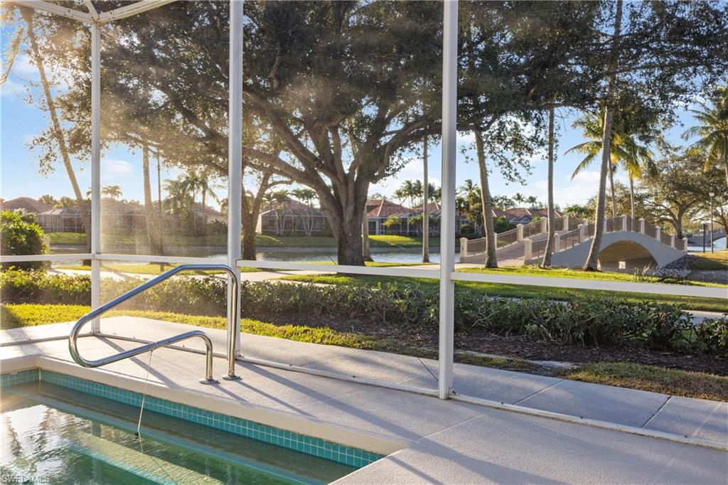 4708 Rio Poco Court Naples, FL 34109 - Photo 33 of 37 View of pool with a water view and a sunroom